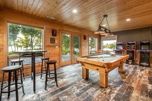 Perfect place to gather with family or friends - play pool, NBA Jam, NFL Blitz, or PAC-man or gather at the table and chat while enjoying views of Lake Latoka.