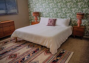 Master bedroom with plush king bed