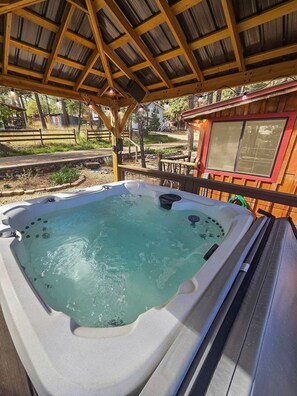 Soak your cares away under the stars in your private hot tub retreat.