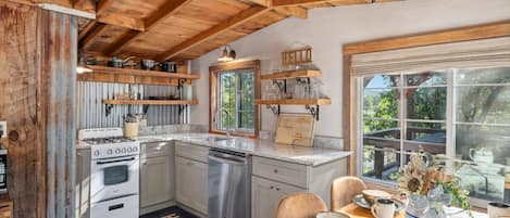Fully Equipped Kitchen with Modern Appliances and Beverage Station