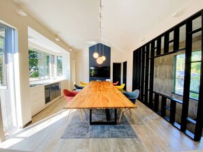 A living room with a large table for a relaxed atmosphere