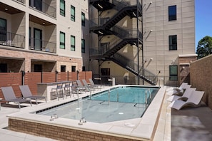 A welcoming shared space featuring contemporary lines, resort-style seating, and a peaceful ambiance.