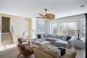Living area with ample seating and flat screen TV