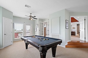 Enjoy this game room with a variety of games