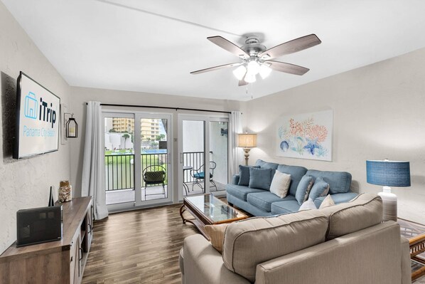 Comfy furnishings in the living room with direct balcony access
