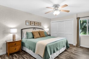 Beachy vibes in this spacious primary bedroom