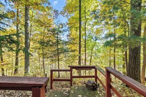 Step out onto this peaceful deck, perfect for soaking in the serene beauty of the surrounding forest. The rustic charm of "My Neck of the Woods" offers the ultimate spot to relax and reconnect with nature. 