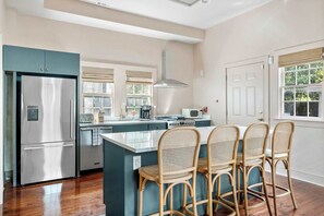 Fully equipped kitchen with everything you need to cook a meal with seating on the island