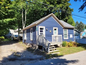 EXTERIOR:  The front of the house from the side.