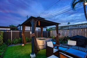 Take advantage of this fully decked out backyard! Hop into the hot tub for a relaxing soak and settle around the conversation set for your morning coffee.