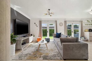 With plenty of natural light and marble polish tile floors that will keep you cool all year round, this spacious living room is a fun and open space for the entire family to spend time in!