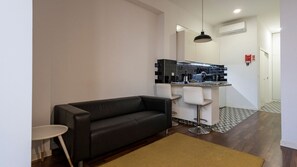 Discover the charm of our living area, adorned with unique accents and comfortable seating #contemporary #practical