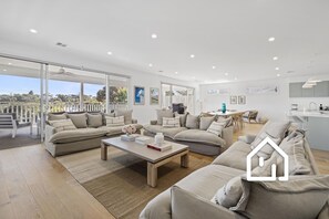 Upstairs expansive open plan living, opening to pool facing alfresco area.  