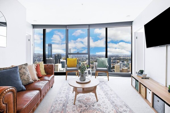 Full-height windows create an impressive backdrop to your stay here.
