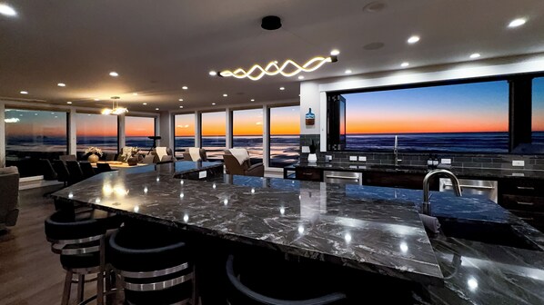 A beautiful sunset through the kitchen & living windows.