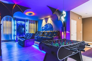 Immerse yourself in the ultimate Batman-themed movie theatre, complete with cinematic details and a foosball table for added fun between films!