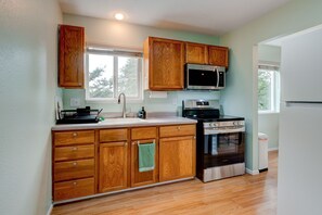 Fully stocked kitchen with new appliances. 