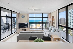 Lounge, kitchen and wrap-around balcony offers amazing views of the beach