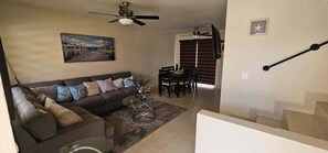 Spacious living room equipped with a Smart TV