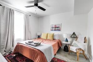 Well appointed, comfortable queen bed with colorful decor and black out shades if needed.
