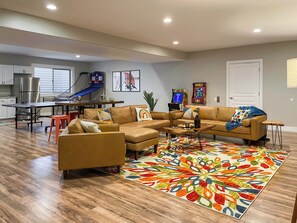 The whole group will love the lower level family room, with arcade games, pop-a-shot, ping-pong, and a big screen TV for movies or the game. It’s the perfect spot to kick-back, relax, have fun, and make lasting memories together!    