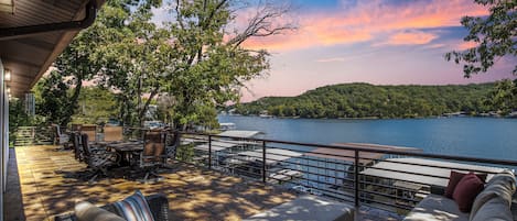 Unwind on the spacious deck with stunning sunset views over the serene lake.