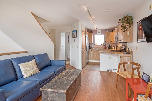 Dining/living level features half bath and private deck.