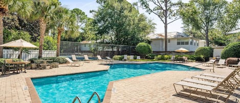 Island Retreat has a beautiful pool with plenty of tables and lounge chairs. A tennis/pickleball court is also available for your use.