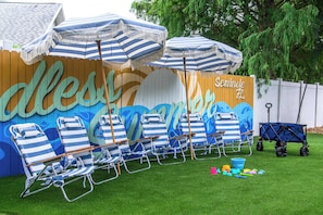 Enjoy the ultimate beach experience in your backyard with 6 beach chairs, a beach trolley for convenience, and a collection of toys for family fun