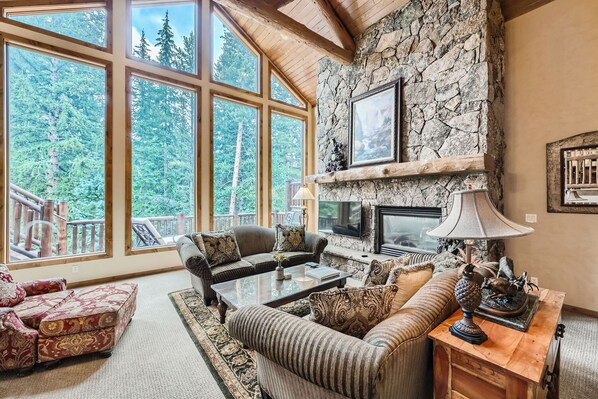 Curl up in the cozy living room & stream your favorites by the fireplace