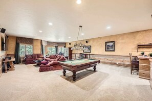 Enjoy a move night or a round of pool in the lower-level den, with wet bar!