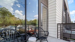 Balcony off of the living area with seating for two