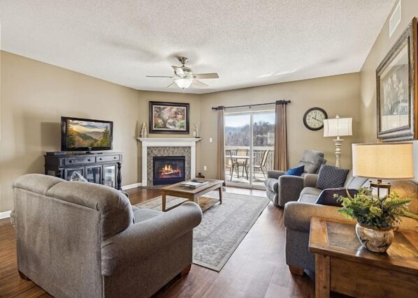 Spacious Living Room with Gas Fireplace, Sleeper Sofa and SMART TV with Cable & WIFI throughout vacation rental