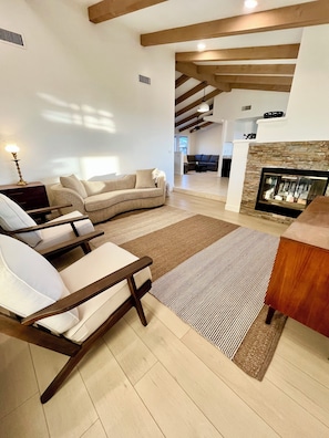 Modern, stylish living room open to the main area of the house.