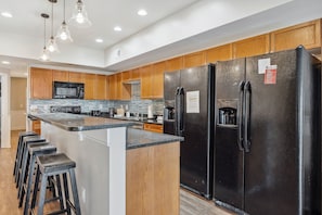 Large kitchen with two full refrigerators