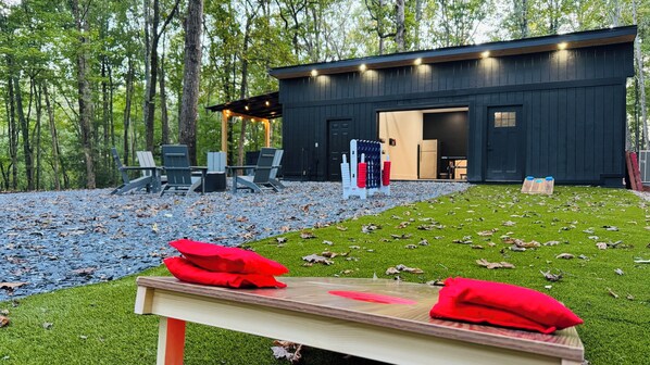 Large, spacious, fun backyard with giant games for kids and cornhole for adults.