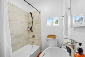 Enjoy the calming ambiance of this bathroom, where a hot shower or a long bath can melt away your worries, leaving you refreshed and relaxed.