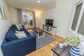 Cozy family room with a queen sofa bed and room-darkening curtains