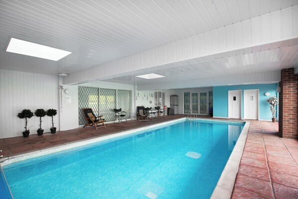 The large and private heated indoor swimming pool.