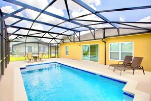 Plenty of space around the pool for sitting and relaxing on deck furniture provided