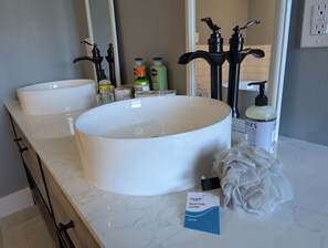 Upstairs master bathroom has a double bowl sink