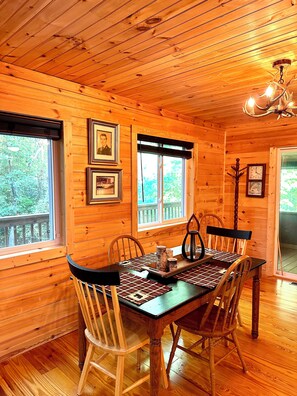 Dining table open to kitchen and living room