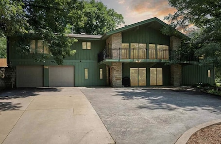 back side of house with garage access for parking