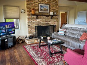 The great room features a comfortable sitting area and Smart TV for streaming. 