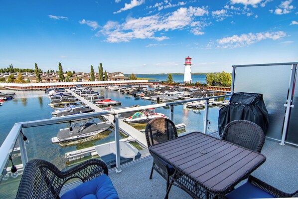 Sip your coffee while you watch boats make their way in & out of the Marina