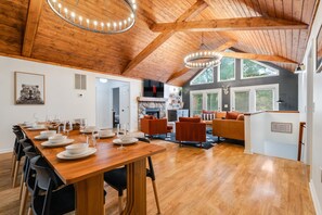 This stunning retreat features a gorgeous wood and bean ceiling, coxy gas fireplace, a luxurious leather section and spacious dining area with seating for 12. 