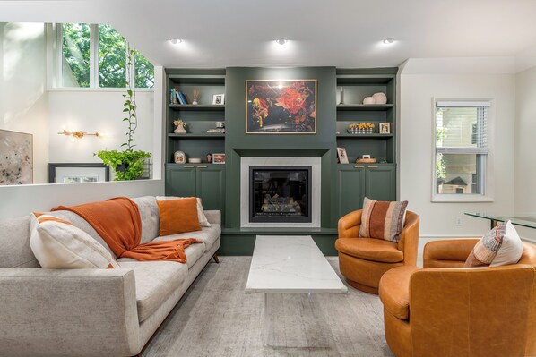 Great room with fireplace (view from kitchen).