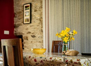 Dining table with a vase of flowers