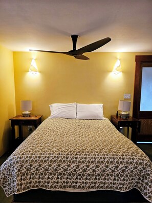 The spacious main bedroom has a queen bed with organic latex topper.