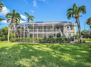 View of back of house/pool cage